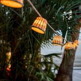Aurora Solar String Lights - lit in a palm tree