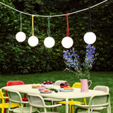 Bolleke Hanging Lamp - over a garden dining table at dusk