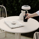Black/Opal Blossi Mini Portable Table Lamp by Nuura in Outdoor Area