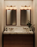 Brushed Gold/Glossy Ribbed Opal Glass Cherise Vanity Light by Alora Lighting in Bathroom