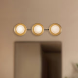 Cleo Vanity Light Brushed Gold Opal Glass Kuzco - Lifestyle View