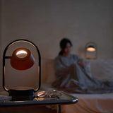 Coral Orange Olo Ring Portable Table Lamp by Seed Design in Bedroom