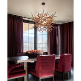 Cura Pendant Light by Cerno lifestyle - walnut nest pendant above a dining room table