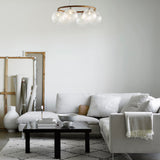Dark Bronze/Optic Clear 6 Lights Miira Circular Chandelier by Nuura in Living Room