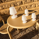 Edison The Mini Table Lamp (Set of 3) - on an outdoor table at sunset