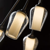 Flora 6 Arm Chandelier detail in Dark Smoke, Seeded Glass with Opal Diffuser, by Hubbardton Forge