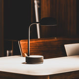 Fokus Battery Table Lamp - Anthracite, on a desk