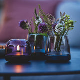Glow 10 Candle Holder - with flowers on a side table