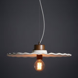 Guanabara Pendant Light by Geo Contemporary in White with copper fittings, lit against a charcoal studio backdrop