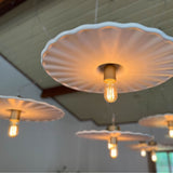 Guanabara Pendant Light by Geo Contemporary in White with gold fittings, a group of pendants glowing beneath a timber ceiling