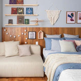 Guanabara Pendant Light by Geo Contemporary in White with copper fittings in a bedroom with a timber headboard