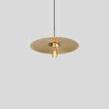 Ico Pendant Light by Cerno in spun solid brass, shown with a narrow Edison bulb