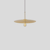 Ico Pendant Light by Cerno in spun solid brass seen from above, narrow Edison bulb