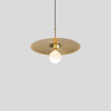 Ico Pendant Light by Cerno in spun solid brass, shown with a round frosted bulb
