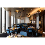 Ico Pendant Lights by Cerno lifestyle - spun brass cymbal pendants in a restaurant dining room