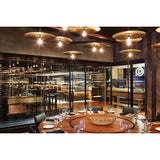 Ico Pendant Lights by Cerno lifestyle - cluster of brass cymbal pendants over a restaurant dining area