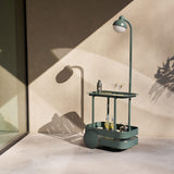 Jolly Trolley Lighted Bar Cart - Dark Sage, in a sunlit corner