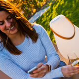 Kurby Play Portable Lamp - beside a guest on a terrace