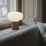 Karl-Johan Portable Table Lamp Earth Red By New Works - Lifestyle View1