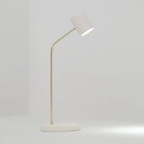 Lola Ceramic Table Lamp by Geo Contemporary in White with a gold stem, lit