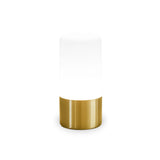Maia rechargeable table lamp by New Garden, illuminated white cylindrical shade on a brushed brass base