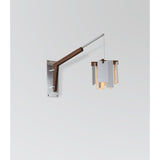 Motus Swing Arm Bracket by Cerno in brushed aluminum with walnut body, shown with a Salix pendant (sold separately)