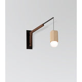 Motus Swing Arm Bracket by Cerno in textured black with walnut body, shown with a Bimar pendant (sold separately)