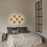 Nordic Gold/Optic Clear Liila 7 Wall/Ceiling Light by Nuura in Bedroom