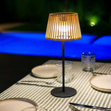 Okinawa Solar Table Lamp - lit by a pool at night