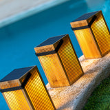Okinawa Solar Lantern - solar panels by a pool