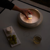 Oloha Table and Wall Lamp - Medium, Desert, on a table