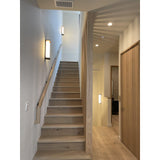 Ora Wall Sconce by Cerno lighting a staircase