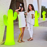 Pancho Floor Lamp - Lime With Cable, beside two guests
