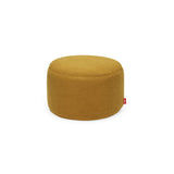 Round ochre-yellow ottoman upholstered in soft fleecy sherpa fabric with a small red Fatboy tab — Point Large Sherpa Ottoman & Footrest by Fatboy