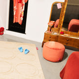 Point Recycled Velvet Pouf Ottoman - in a living room