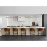 Penna Linear Pendants by Cerno above a kitchen island