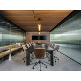 Penna Linear Pendant by Cerno over a conference table