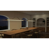 Penna Linear Pendants by Cerno over a long dining table at night