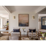 Rima Wall Sconces by Cerno flanking artwork in a living room