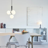Rock Grey/Opal Miira Table Lamp by Nuura in Dining Area