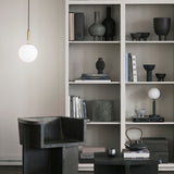 Rock Grey/Opal Miira Table Lamp by Nuura in Study Room