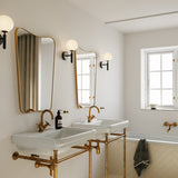 Rock Grey/Opal Miira Wall Sconce by Nuura in Bathroom
