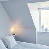 Rock Grey/Optic Clear Miira Table Lamp by Nuura in Bedroom