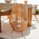 Sisine Floor Lamp - beside a beach table, close up