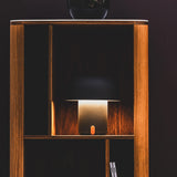 Sensa Battery Table Lamp - Anthracite, in a bookcase