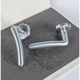 Sirio Door Lever in Satin Chrome lifestyle view by Colombo Design