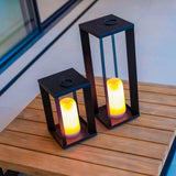 Siroco Portable Lantern - Small and Large, on a patio table