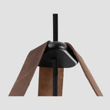 Stillo Pendant Light by Cerno in Deux - black metal accent and brown leather strap detail