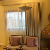 Sunset Ceramic Pendant Light by Geo Contemporary lit in a sitting room with sheer linen curtains