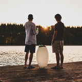 Synergy Battery Wine Cooler Lamp - Large, on a lakeside jetty